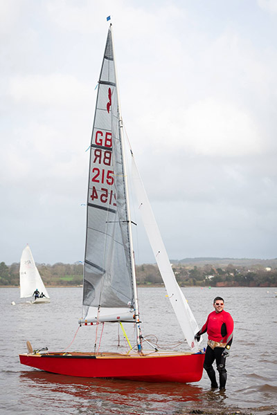 Sailor holding boat