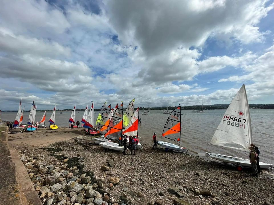 Youth singlehanders at water's edge